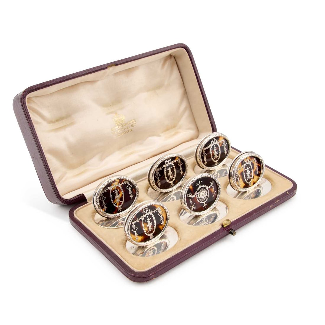 A MATCHED SET OF SIX GEORGE V SILVER AND TORTOISESHELL MENU HOLDERS: A MATCHED SET OF SIX GEORGE V SILVER AND TORTOISESHELL MENU HOLDERS by Charles & Richard Comyns and William Comyns & Sons, London 1911 and 1920, each oval decorated with silver piqué work, in