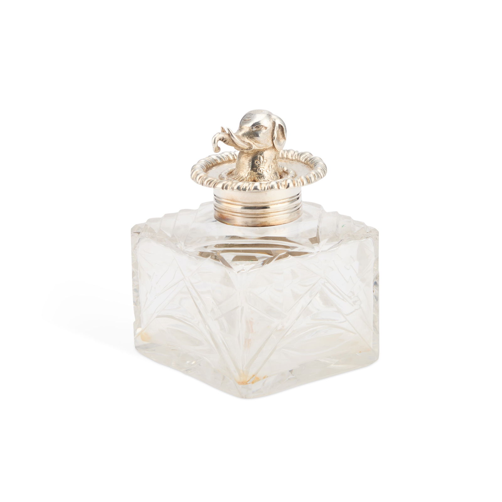 A VICTORIAN SILVER-TOPPED INKWELL: A VICTORIAN SILVER-TOPPED INKWELL by George Fox, London 1874, the hinged silver lid surmounted by the head of an elephant. 9cm high The marks are clear. The hinged top opens and closes well. The cut-