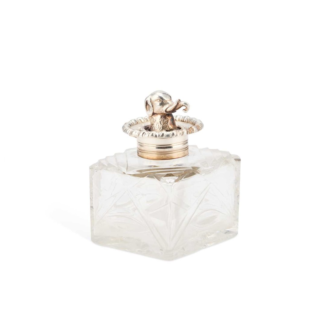 A VICTORIAN SILVER-TOPPED INKWELL: A VICTORIAN SILVER-TOPPED INKWELL by George Fox, London 1874, the hinged silver lid surmounted by the head of an elephant. 8.7cm high The marks are clear. The hinged top opens and closes well. The cu
