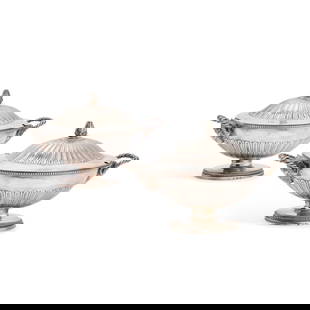 A PAIR OF GEORGE III SILVER SAUCE TUREENS: A PAIR OF GEORGE III SILVER SAUCE TUREENS by Andrew Fogelberg & Stephen Gilbert, London 1780, oval, the covers with fluted domed centres surmounted by a compressed bun finial, the bowls with a ram