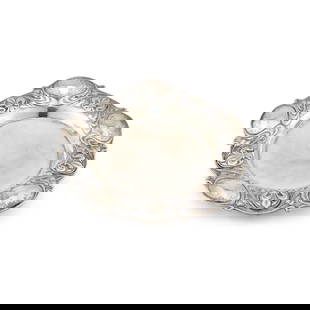 RAMSDEN & CARR: AN ARTS AND CRAFTS SILVER DISH: RAMSDEN & CARR: AN ARTS AND CRAFTS SILVER DISH by Omar Ramsden & Alwyn Carr, London 1912, of shaped circular form, chased with fleur-de-lis roundels and whiplash, inscribed OMAR RAMSDEN ET ALWYN C
