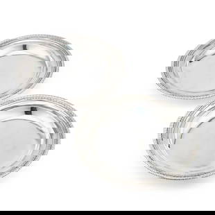 PAUL DE LAMERIE: A PAIR OF GEORGE I SILVER SECOND COURSE DISHES: PAUL DE LAMERIE: A PAIR OF GEORGE I SILVER SECOND COURSE DISHES by Paul de Lamerie, London 1725, circular with gadrooned and rosette-ovolo borders. (2) 28cm diameter, 61 troy ounces gross The marks a
