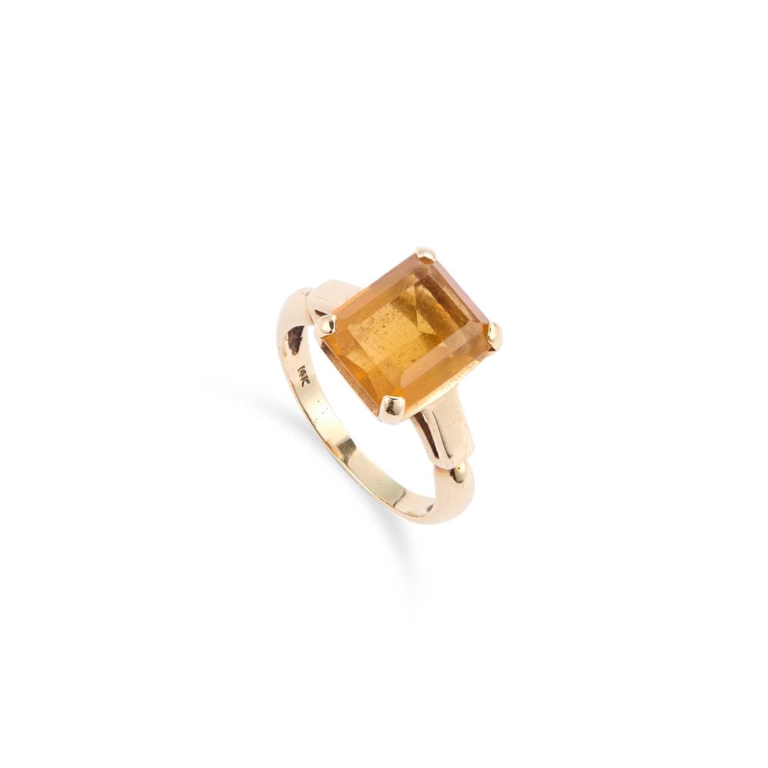 A SOLITAIRE CITRINE RING: A SOLITAIRE CITRINE RING an octagonal-cut citrine to panelled shoulders, stamped '14K'. Ring size P, 5.1 grams Good condition, the citrine measures 12mm x 10mm approximately