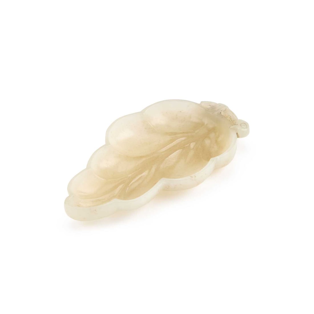 A CHINESE JADE BRUSH WASHER: A CHINESE JADE BRUSH WASHER carved in the form of a leaf, the stone of pale celadon tone with natural inclusions. 12cm long