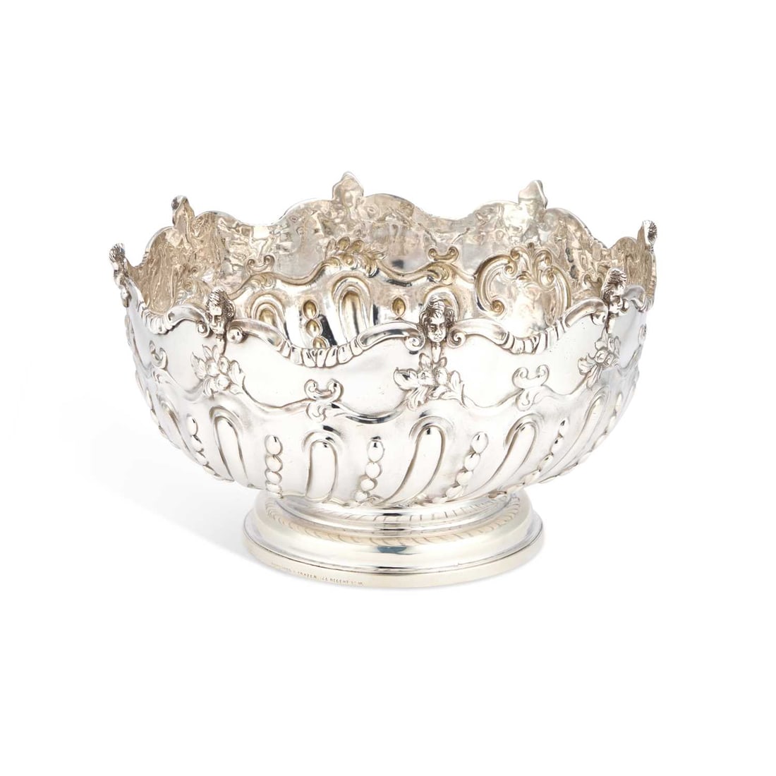 A VICTORIAN SILVER 10-INCH BOWL: A VICTORIAN SILVER 10-INCH BOWL by Charles Stuart Harris, London 1890, circular with rounded sides and a stepped circular foot, the rim applied with scrolls interspersed by cherubic masks, the sides c