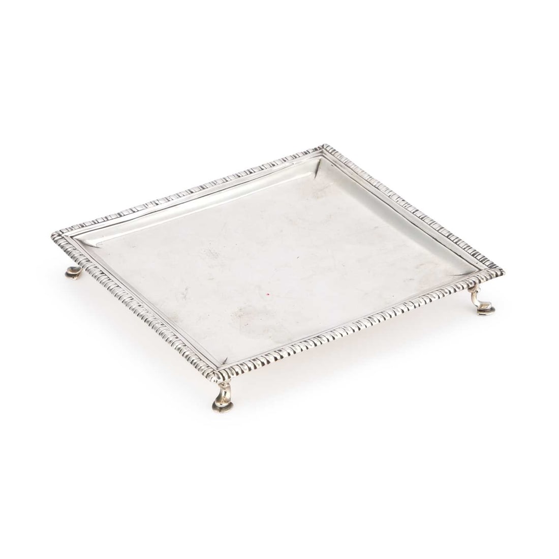 A GEORGE II SILVER SALVER: A GEORGE II SILVER SALVER by Dorothy Sarbitt, London 1753, square, with a gadrooned edge and C-scroll legs with pad feet. 18cm square, 10.3 troy ounces