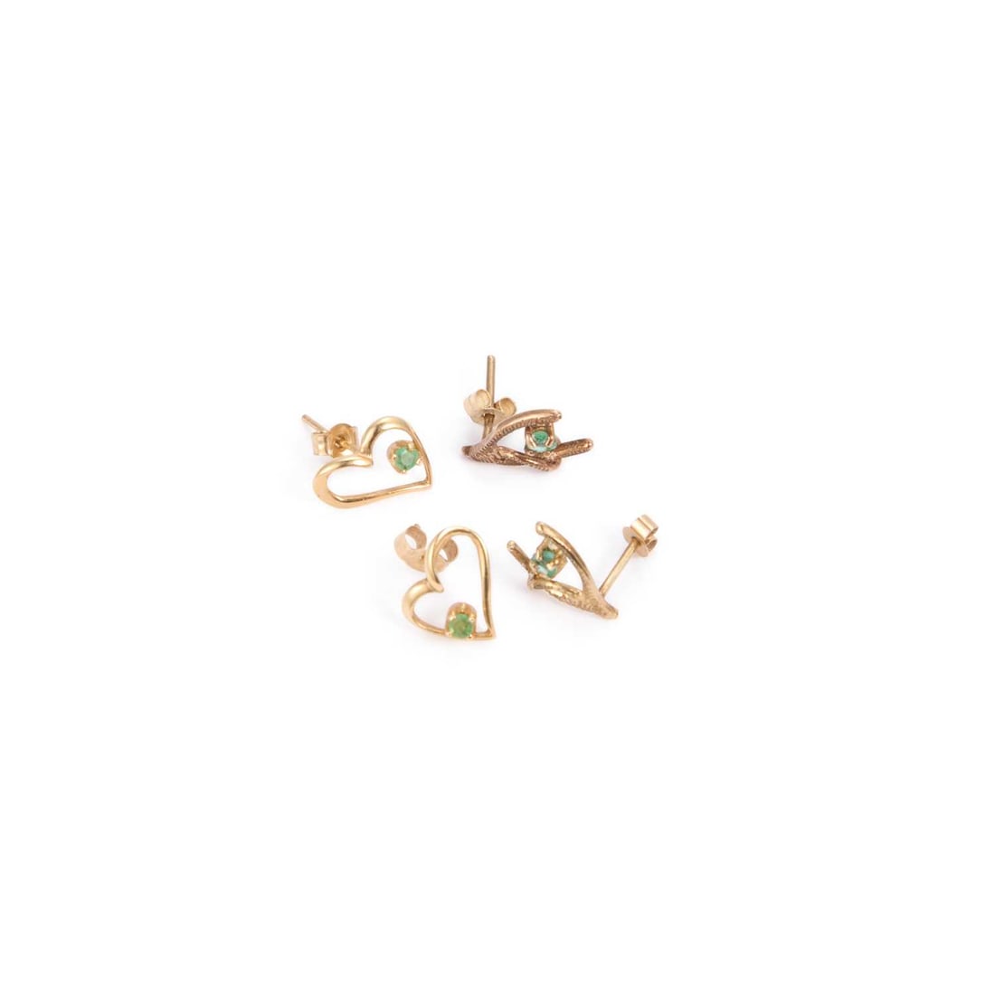 TWO PAIRS OF EMERALD STUD EARRINGS: TWO PAIRS OF EMERALD STUD EARRINGS comprising a pair of 9 carat gold wishbone pattern earrings, hallmarked Birmingham 1978, and a pair of heart-shaped earrings, stamped 'S14KP'. (2) 1cm long, 1.6 gram