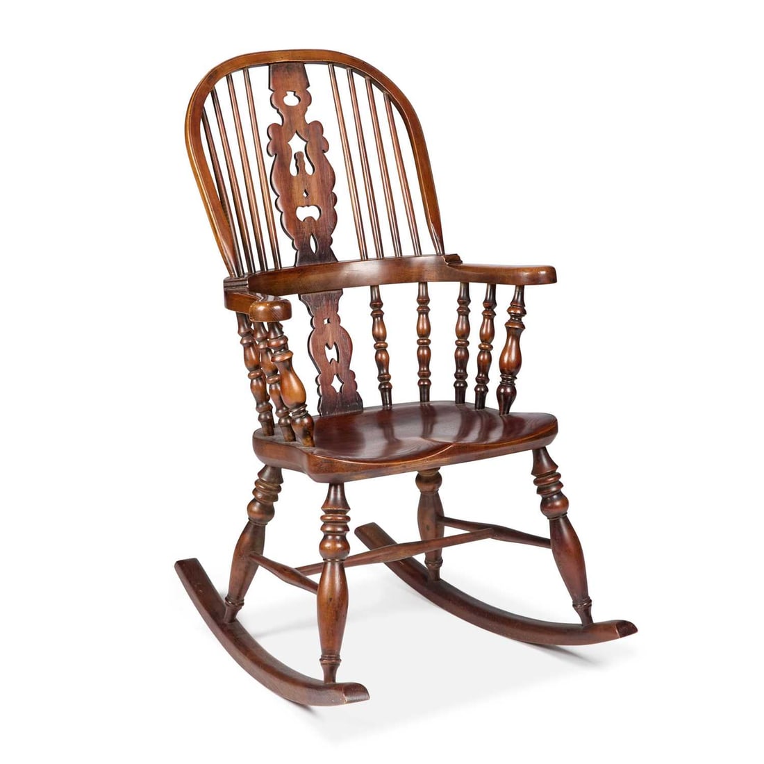 AN OAK AND ELM BROADARM WINDSOR ROCKING CHAIR: AN OAK AND ELM BROADARM WINDSOR ROCKING CHAIR with a high-back and baluster legs. Height of back 116cm