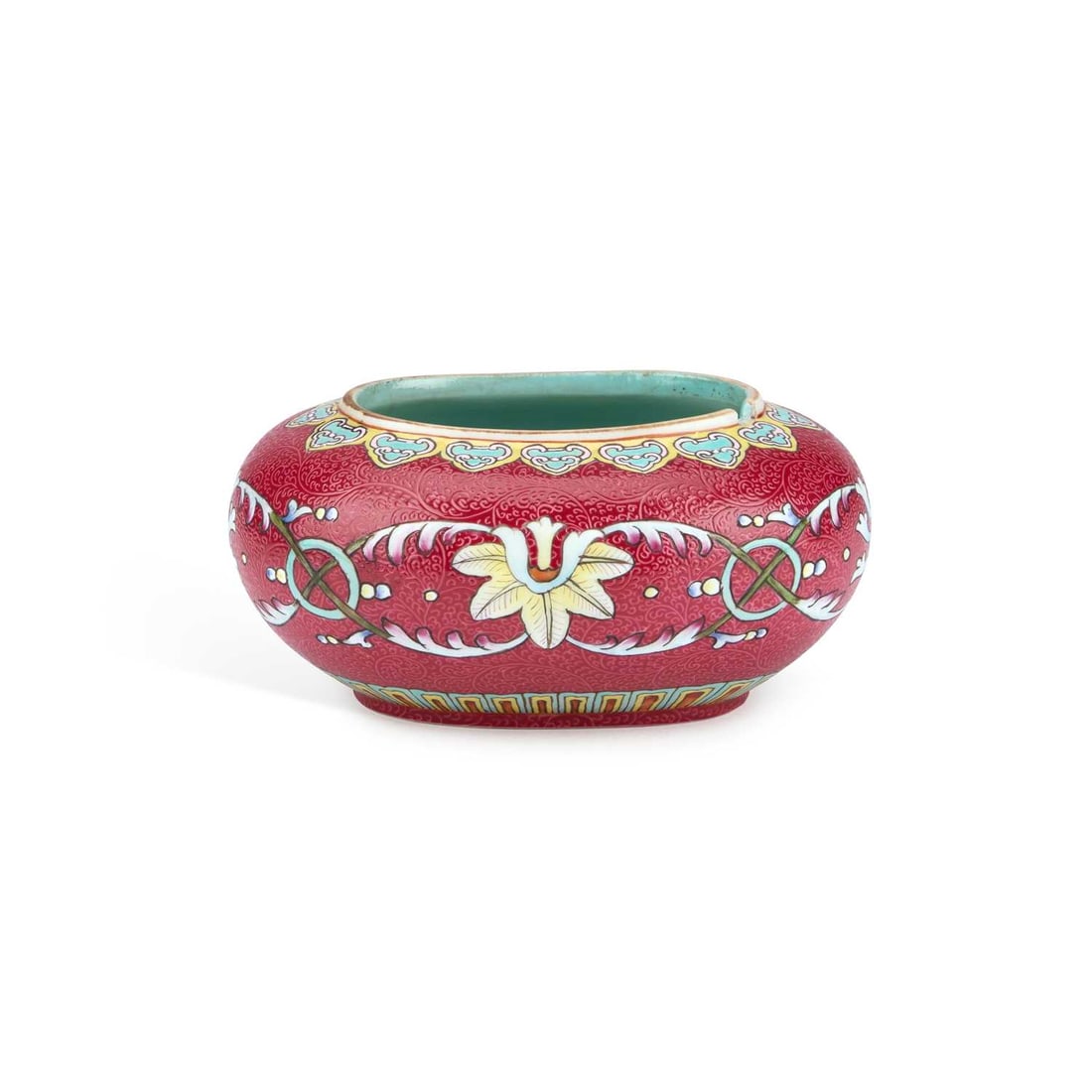 A CHINESE RUBY-GROUND BRUSH WASHER: A CHINESE RUBY-GROUND BRUSH WASHER oval, the sgraffito ground enamel painted with flowers and scrolling foliage, bears a blue square mark. 13cm long No chips, cracks or restoration. In good condition.
