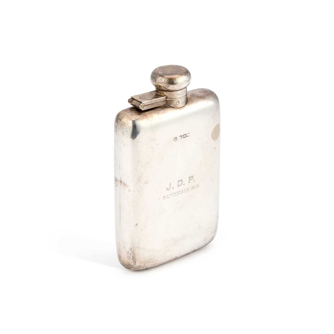 A GEORGE V SILVER HIP FLASK: A GEORGE V SILVER HIP FLASK by William Hutton & Sons Ltd, Sheffield 1915, of rounded rectangular form with gently rounded corners, designed for comfortable pocket carrying, with a hinged bayonet c