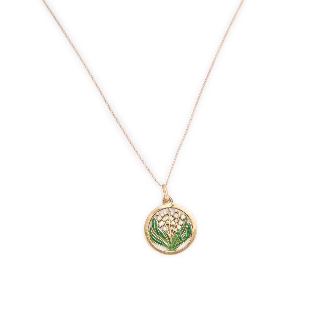 AN ENAMELLED LILY OF THE VALLEY PENDANT NECKLACE: AN ENAMELLED LILY OF THE VALLEY PENDANT NECKLACE the pierced circular pendant filled with coloured enamel, to a fine chain, French marks. Pendant 2.2cm diameter, chain 45.5cm long, 1.8 grams XRF tests