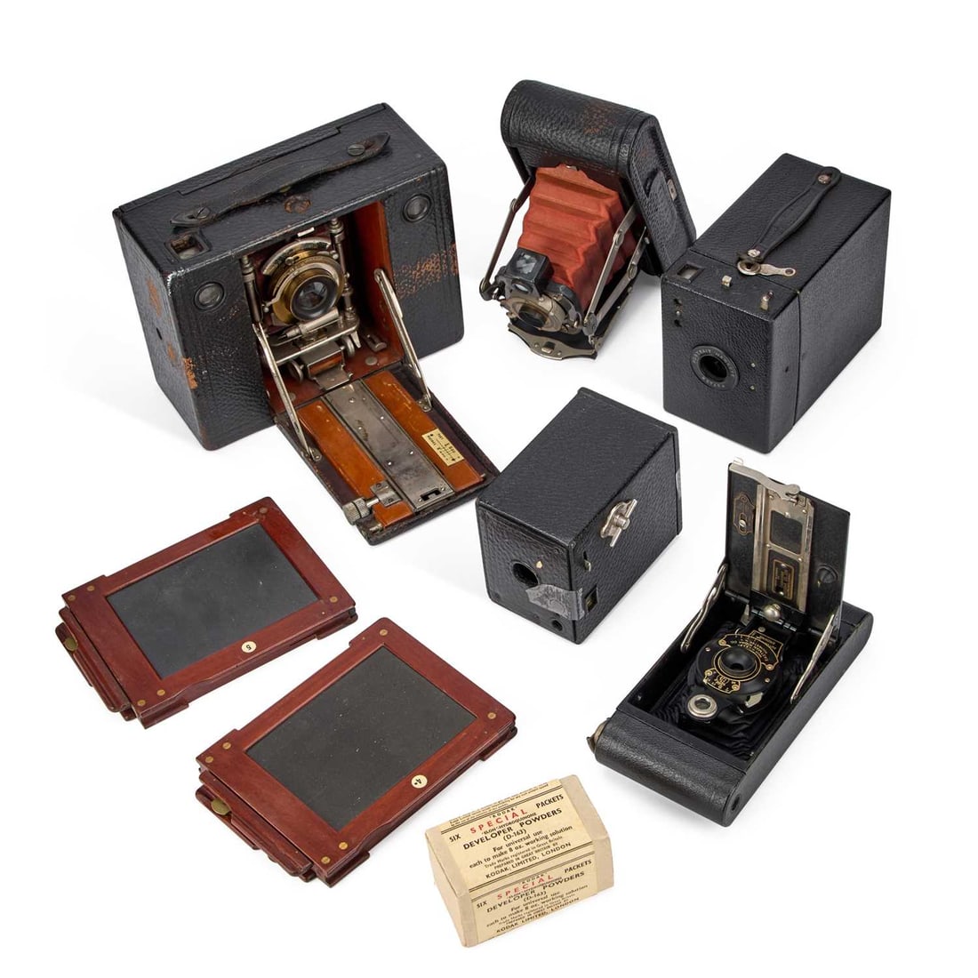 A GROUP OF ANTIQUE AND VINTAGE KODAK CAMERAS: A GROUP OF ANTIQUE AND VINTAGE KODAK CAMERAS including a No.3 Cartridge Kodak Model E, red bellows with a Bausch & Lomb Optical Co Rapid Rectilinear lens; a No.1 Folding Pocket Kodak Model E, red