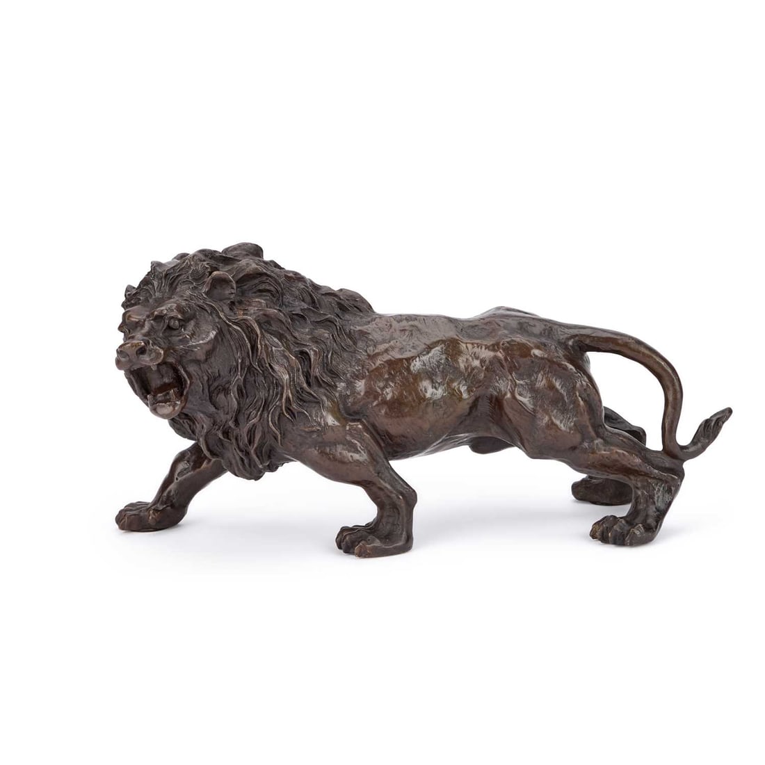 A LATE 20TH CENTURY SCHOOL BRONZE SCULPTURE OF A LION: A LATE 20TH CENTURY SCHOOL BRONZE SCULPTURE OF A LION signed Rodin .16cm high by 31cm wide