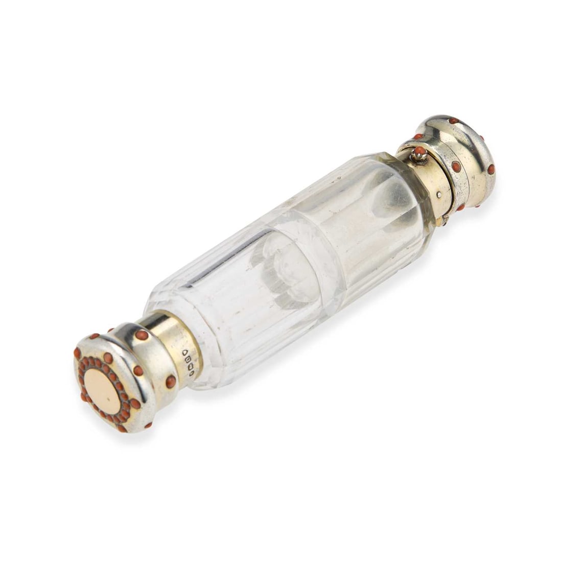 A VICTORIAN SILVER-MOUNTED DOUBLE-ENDED GLASS SCENT BOTTLE: A VICTORIAN SILVER-MOUNTED DOUBLE-ENDED GLASS SCENT BOTTLE by Thomas Johnson I, London 1869, the faceted glass section with a coral-set silver-gilt cover to either end, one with a push-button opening