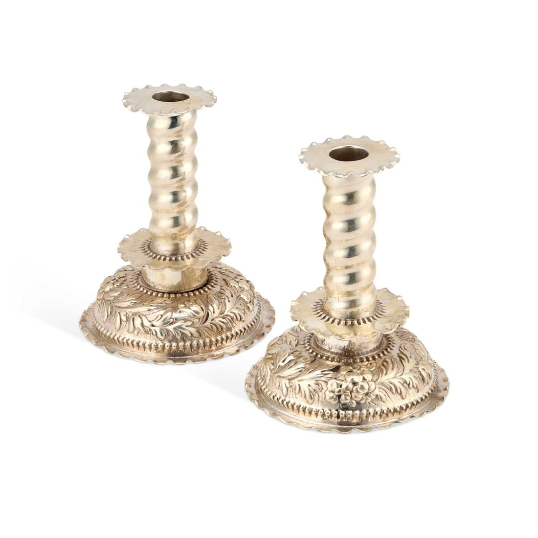 A PAIR OF 17TH CENTURY STYLE SILVER CANDLESTICKS: A PAIR OF 17TH CENTURY STYLE SILVER CANDLESTICKS by George Fox, London 1877, each with a detachable nozzle above a spirally fluted stem with a shaped circular drip pan, over a domed base chased with f
