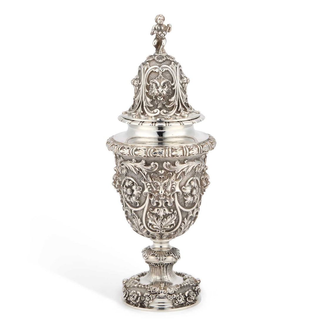 A LARGE VICTORIAN SILVER VASE AND COVER: A LARGE VICTORIAN SILVER VASE AND COVER by George Fox, London 1898, of urn-form with high domed cover and domed foot, boldly cast with masks, scrolling tendrils, leaves and flowers. 28cm high, 34 troy