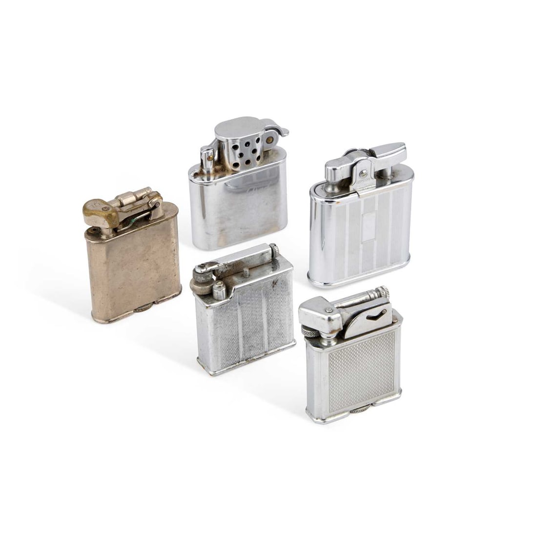 A GROUP OF LIGHTERS: A GROUP OF LIGHTERS including a Ronson 'Whirlwind', Ronson Storm, Polo, etc. (5)