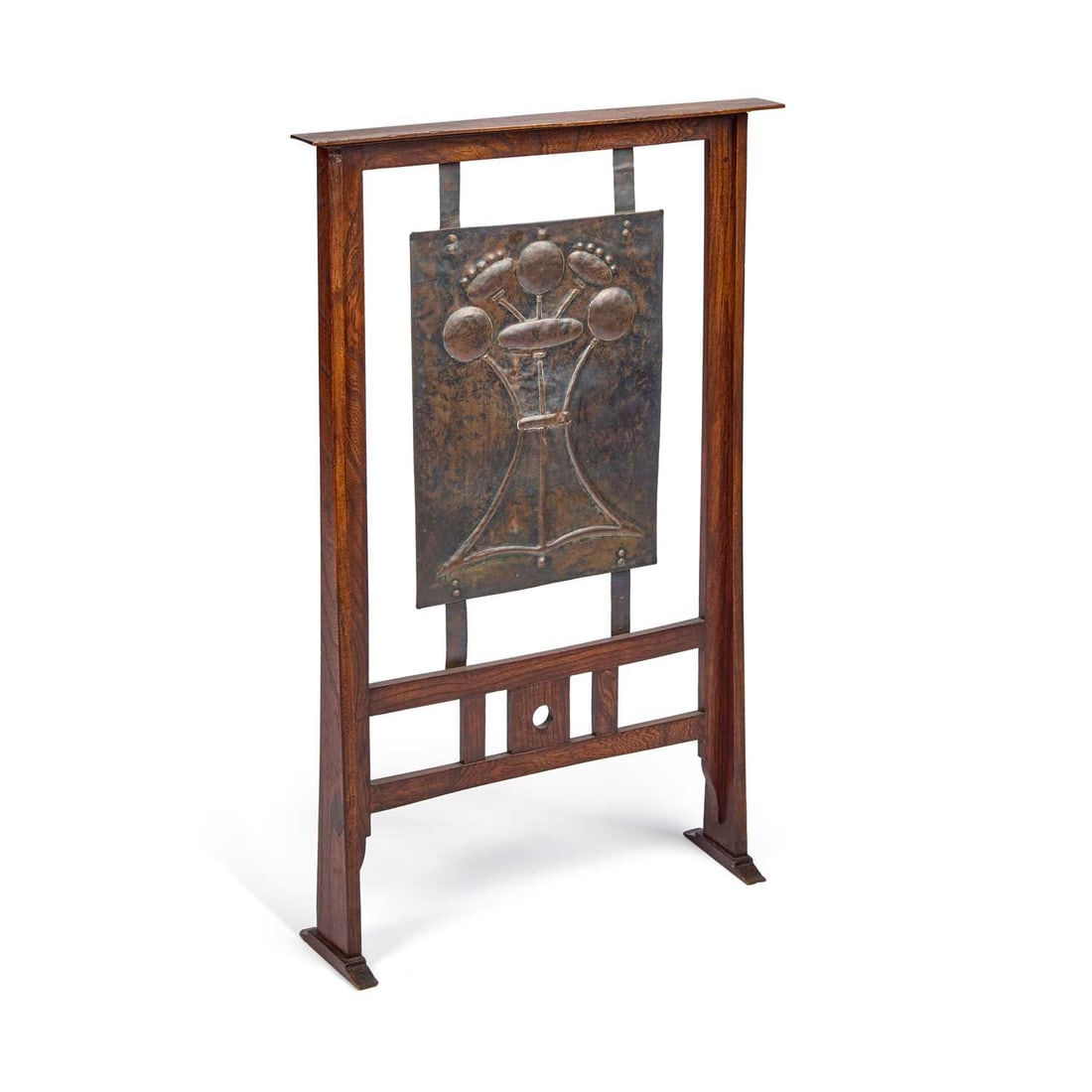 AN ARTS AND CRAFTS OAK AND COPPER FIRESCREEN THE DESIGN ATTRIBUTED TO GEORGE WALTON: AN ARTS AND CRAFTS OAK AND COPPER FIRESCREEN THE DESIGN ATTRIBUTED TO GEORGE WALTON the central copper panel decorated in relief with stylised plants. 88cm high, 56.5cm wide