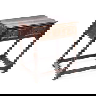 A 17TH CENTURY OAK SIDE TABLE: A 17TH CENTURY OAK SIDE TABLE the rectangular top above a frieze drawer, raised on block and baluster legs joined by stretchers. 61.5cm high, 62cm wide, 46cm deep