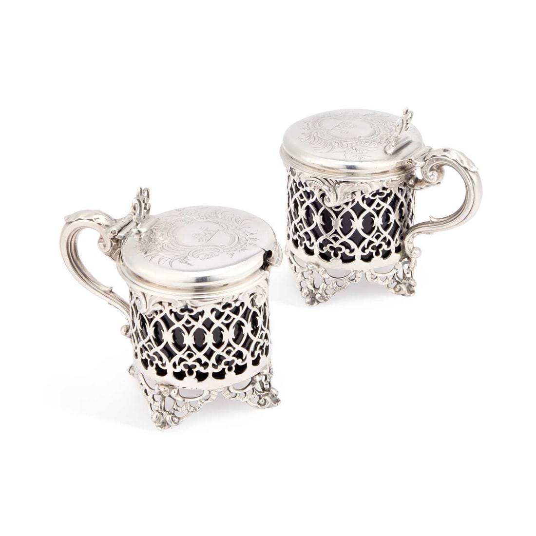 A PAIR OF EARLY VICTORIAN SILVER MUSTARD POTS: A PAIR OF EARLY VICTORIAN SILVER MUSTARD POTS one by Charles Fox II, London 1838, the other by Charles Thomas Fox & George Fox, London 1842, each with pierced sides and a domed hinged cover engrav