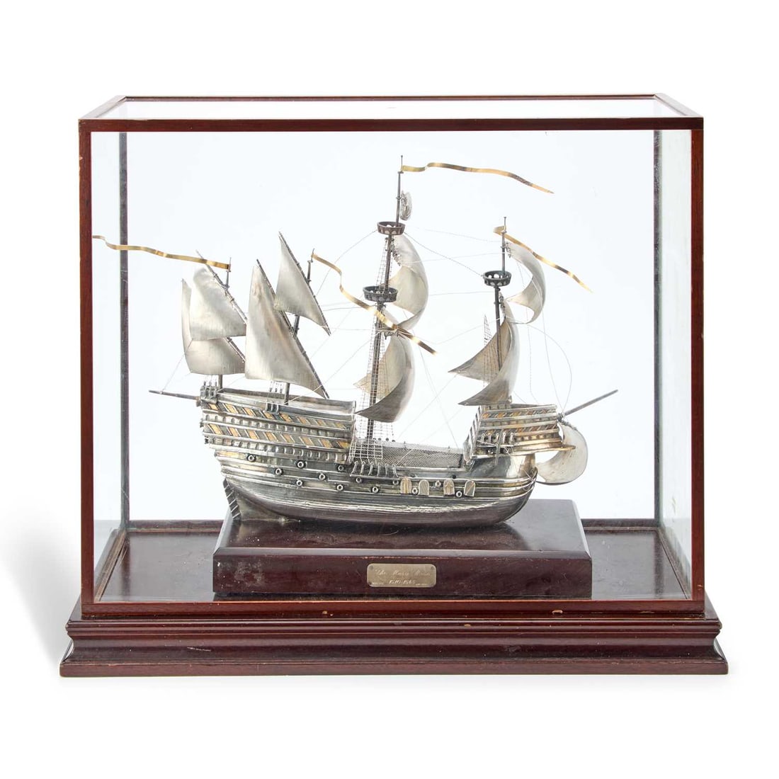 A LARGE SILVER MODEL OF THE MARY ROSE, THE FLAGSHIP OF KING HENRY VIII: A LARGE SILVER MODEL OF THE MARY ROSE, THE FLAGSHIP OF KING HENRY VIII by Ammonite Ltd., Birmingham 1982, modelled in full sail and mounted to a wood plinth set with an engraved plaque inscribed The M