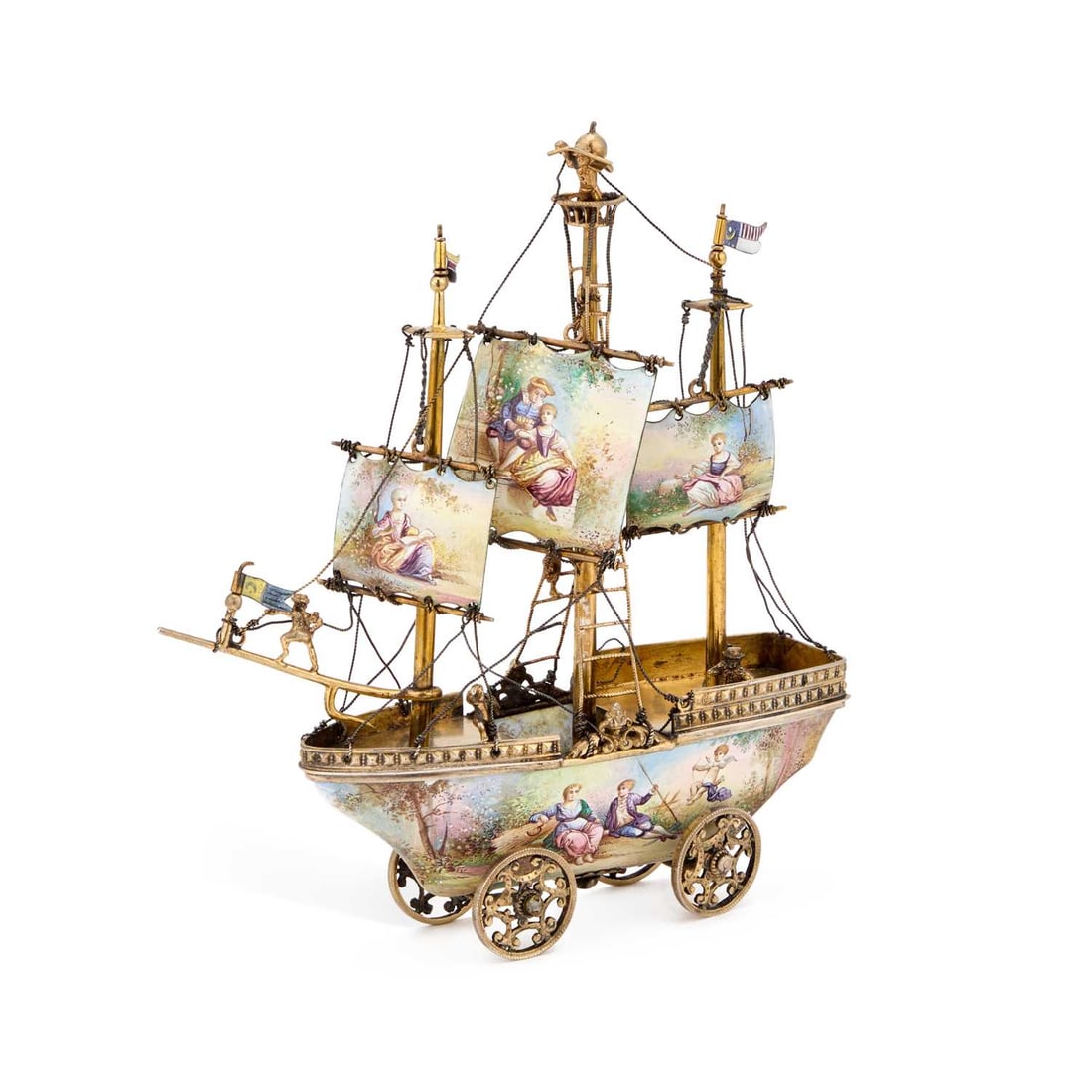 A VIENNESE SILVER-GILT AND ENAMEL NEFF: A VIENNESE SILVER-GILT AND ENAMEL NEFF apparently unmarked, last quarter 19th Century, modelled as a three-masted galleon with enamelled sails depicting figures, three enamel flags and six applied fig