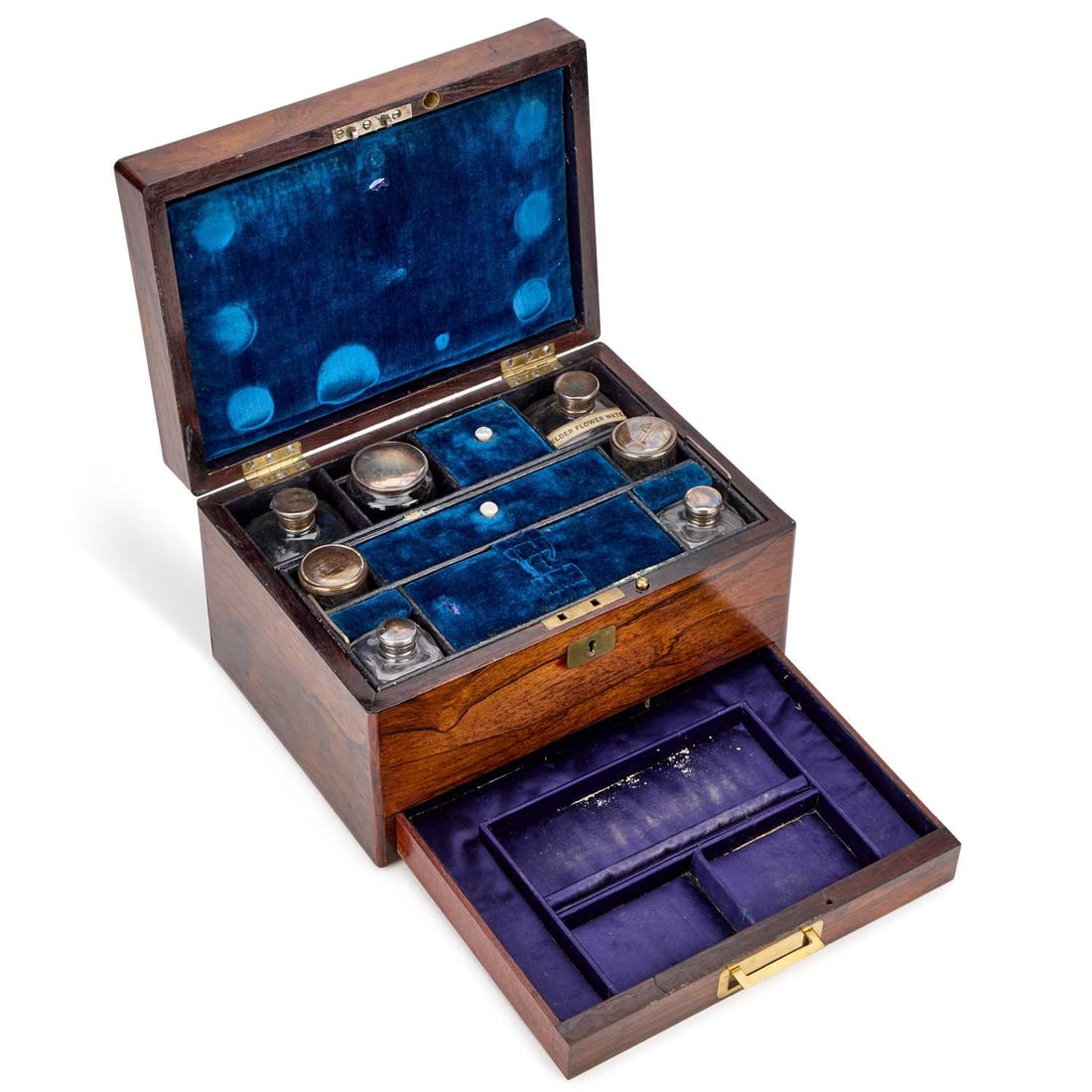 A VICTORIAN ROSEWOOD TOILET BOX: A VICTORIAN ROSEWOOD TOILET BOX fitted with silver-plate topped bottles, the base drawer with a brass campaign handle, engraved E.M.A. Page to an inset brass plaque. 28cm wide