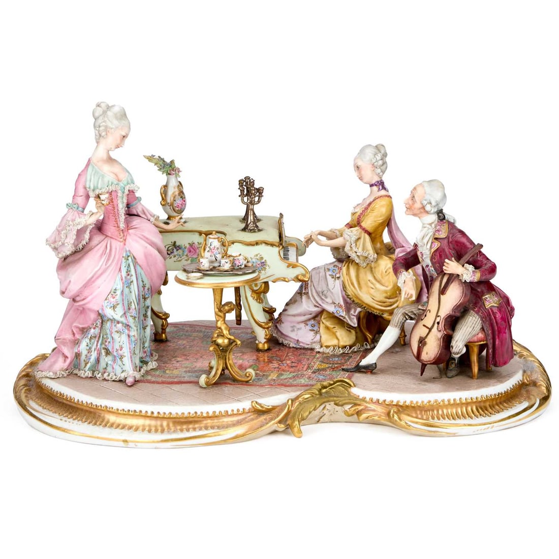 A LARGE CAPODIMONTE GROUP DEPICTING A CONCERT PARTY: A LARGE CAPODIMONTE GROUP DEPICTING A CONCERT PARTY modelled with three musical figures, probably by Giuseppe Cappe. 45cm long