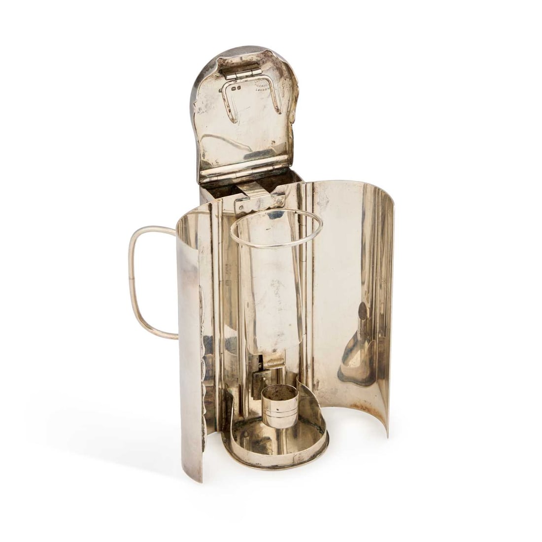 A VICTORIAN SILVER CARRIAGE LAMP: A VICTORIAN SILVER CARRIAGE LAMP by Thomas Johnson I, London 1859, retailed by Leuchars, Piccadilly, London, of shaped rectangular form, the hinged cover with a suspension hook, the hinged front openi