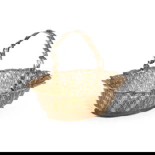 AN UNUSUAL GEORGE III SILVER-GILT FILIGREE BASKET: AN UNUSUAL GEORGE III SILVER-GILT FILIGREE BASKET unmarked, of shaped oval form with a swing-handle, the base engraved with a crest. 26.5cm long, 24.3 troy ounces