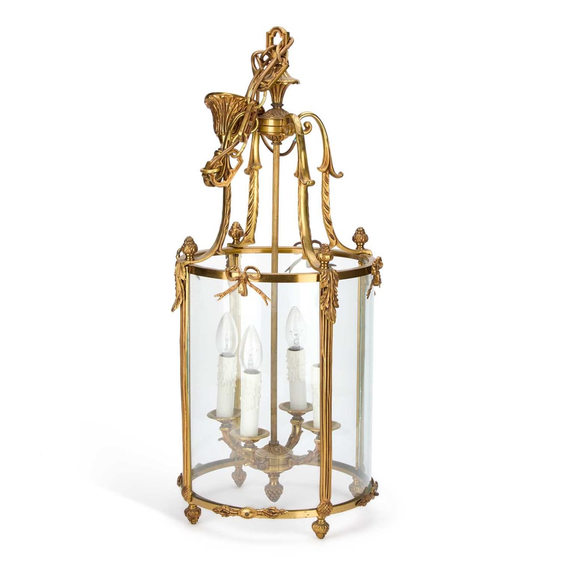 A LARGE FRENCH GILT-METAL LANTERN: A LARGE FRENCH GILT-METAL LANTERN of circular-section with four-form supports and ribbon crests. 73cm high (excl. chain)