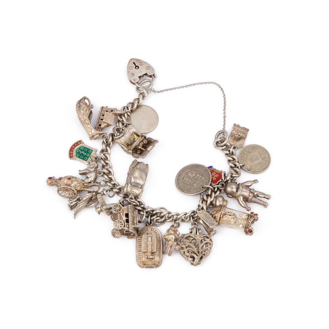 A SILVER CURB LINK CHARM BRACELET: A SILVER CURB LINK CHARM BRACELET with a hallmarked silver heart padlock clasp and various mixed grade charms, including a clock, diver and wagon. 20cm long, 84 grams Good condition