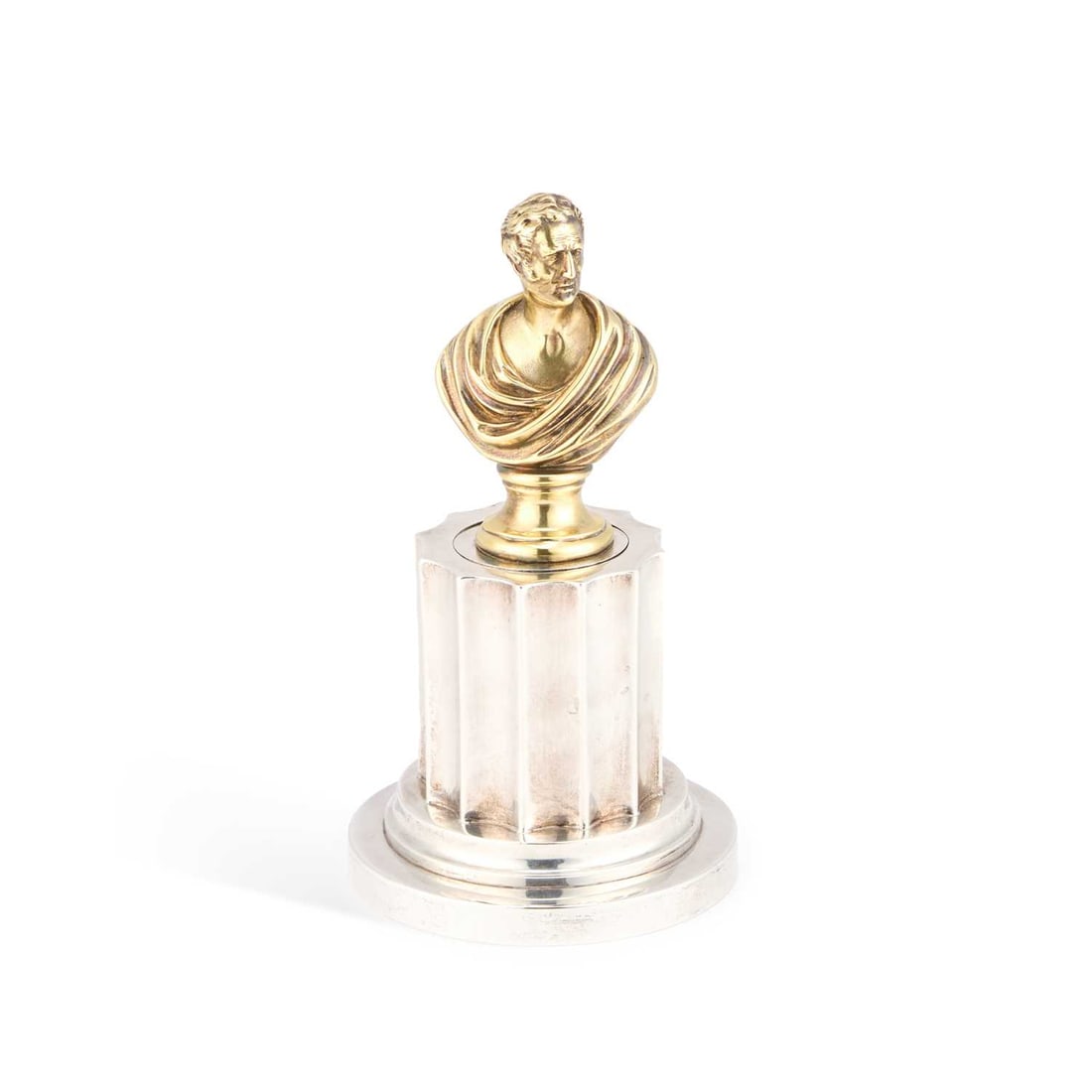 A VICTORIAN SILVER NOVELTY INKWELL THE DUKE OF WELLINGTON: A VICTORIAN SILVER NOVELTY INKWELL THE DUKE OF WELLINGTON by Charles Thomas Fox & George Fox, London 1846, the fluted column raised on a circular stepped base, the hinged cover surmounted by a bus