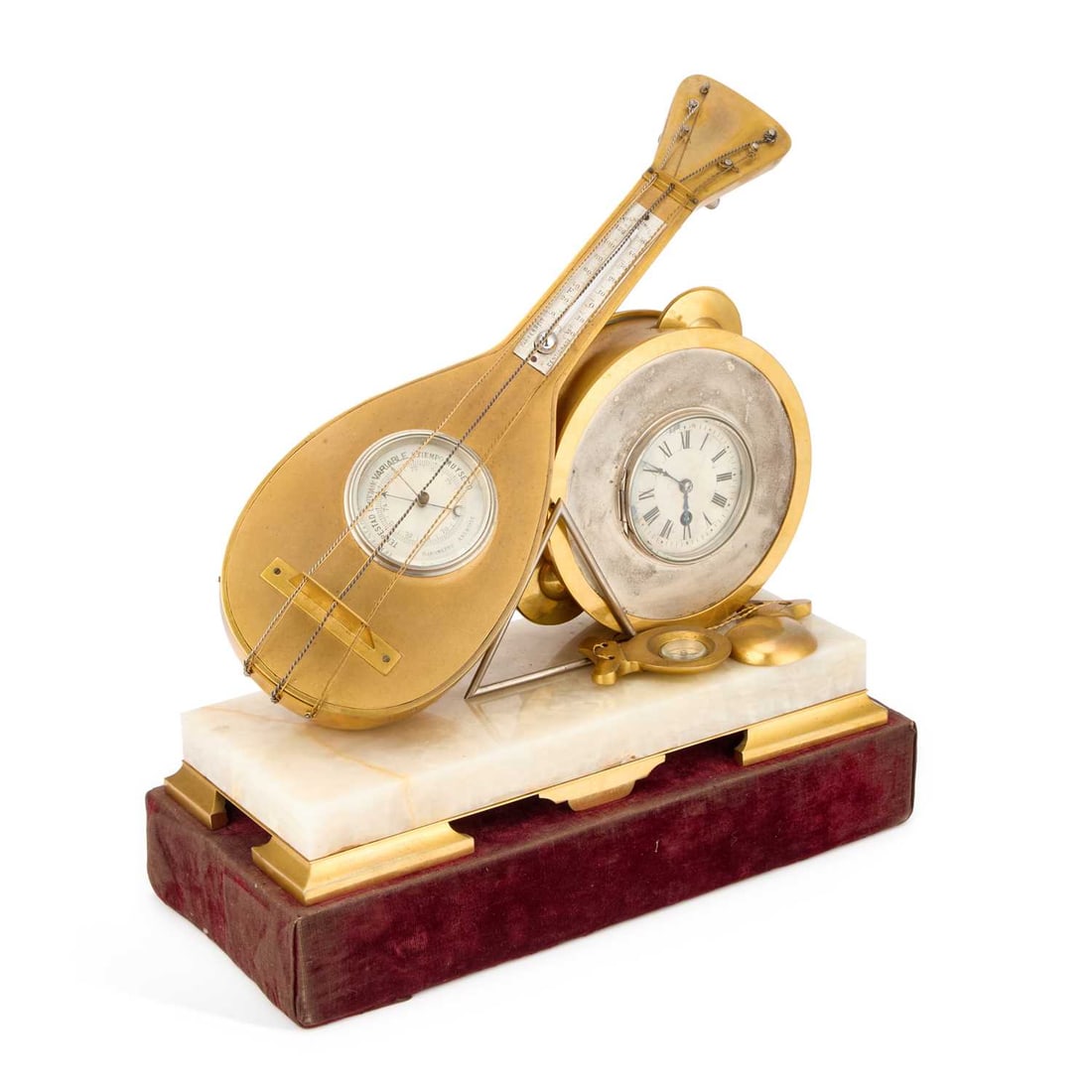 A RARE 19TH CENTURY FRENCH INDUSTRIAL MUSICAL CLOCK COMPENDIUM: A RARE 19TH CENTURY FRENCH INDUSTRIAL MUSICAL CLOCK COMPENDIUM the gilt and silvered case modelled as a mandolin, tambourine, castanets and triangle mounted on a rectangular onyx base, the tambourine