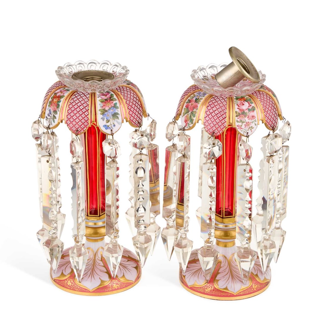 A PAIR OF 19TH CENTURY BOHEMIAN RUBY AND OPAQUE GLASS TABLE LUSTRES: A PAIR OF 19TH CENTURY BOHEMIAN RUBY AND OPAQUE GLASS TABLE LUSTRES each enamel painted with flowers and highlighted with gilding. (2) 26cm high One of the metal nozzles does not fit the glass drip p
