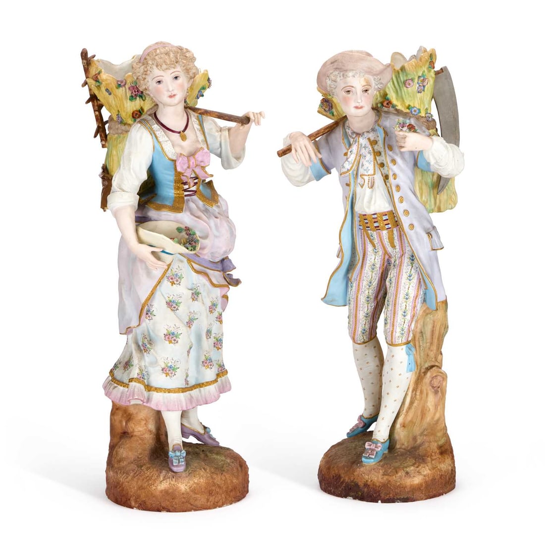 A LARGE PAIR OF GERMAN BISQUE PORCELAIN FIGURES LATE 19TH CENTURY: A LARGE PAIR OF GERMAN BISQUE PORCELAIN FIGURES LATE 19TH CENTURY modelled carrying wheat sheaves on their backs, the female figure holding her hat filled with flowers, her companion offering a small