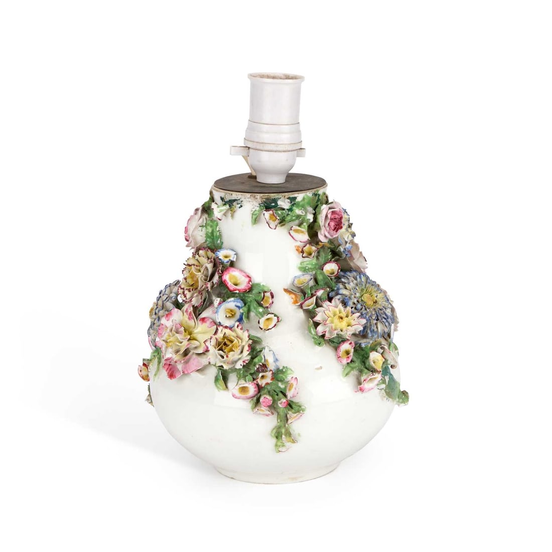 A JACOB PETIT FLORAL ENCRUSTED PORCELAIN LAMP BASE: A JACOB PETIT FLORAL ENCRUSTED PORCELAIN LAMP BASE the squat body boldly applied with polychrome flowers, underglaze blue JP mark. 26cm high