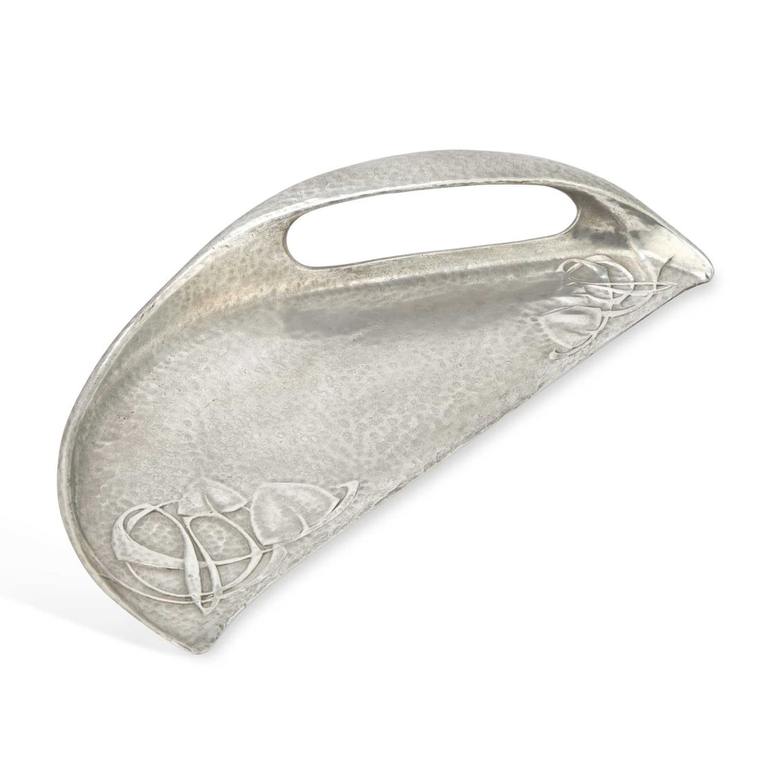 ARCHIBALD KNOX (1864-1933) FOR LIBERTY & CO A TUDRIC PEWTER CRUMB SCOOP: ARCHIBALD KNOX (1864-1933) FOR LIBERTY & CO A TUDRIC PEWTER CRUMB SCOOP of segment form with an asymmetric handle, decorated in low relief with a Celtic knot and leaf design, no. 0532, stamped TUDRIC