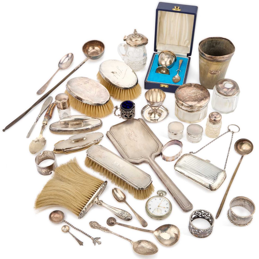 A COLLECTION OF SILVER: A COLLECTION OF SILVER including napkin rings, dressing table accessories, egg cups, a silver-rimmed horn beaker, a few plated articles, etc. (Qty) Beaker 10.5cm high, weighable silver 12 troy ounces
