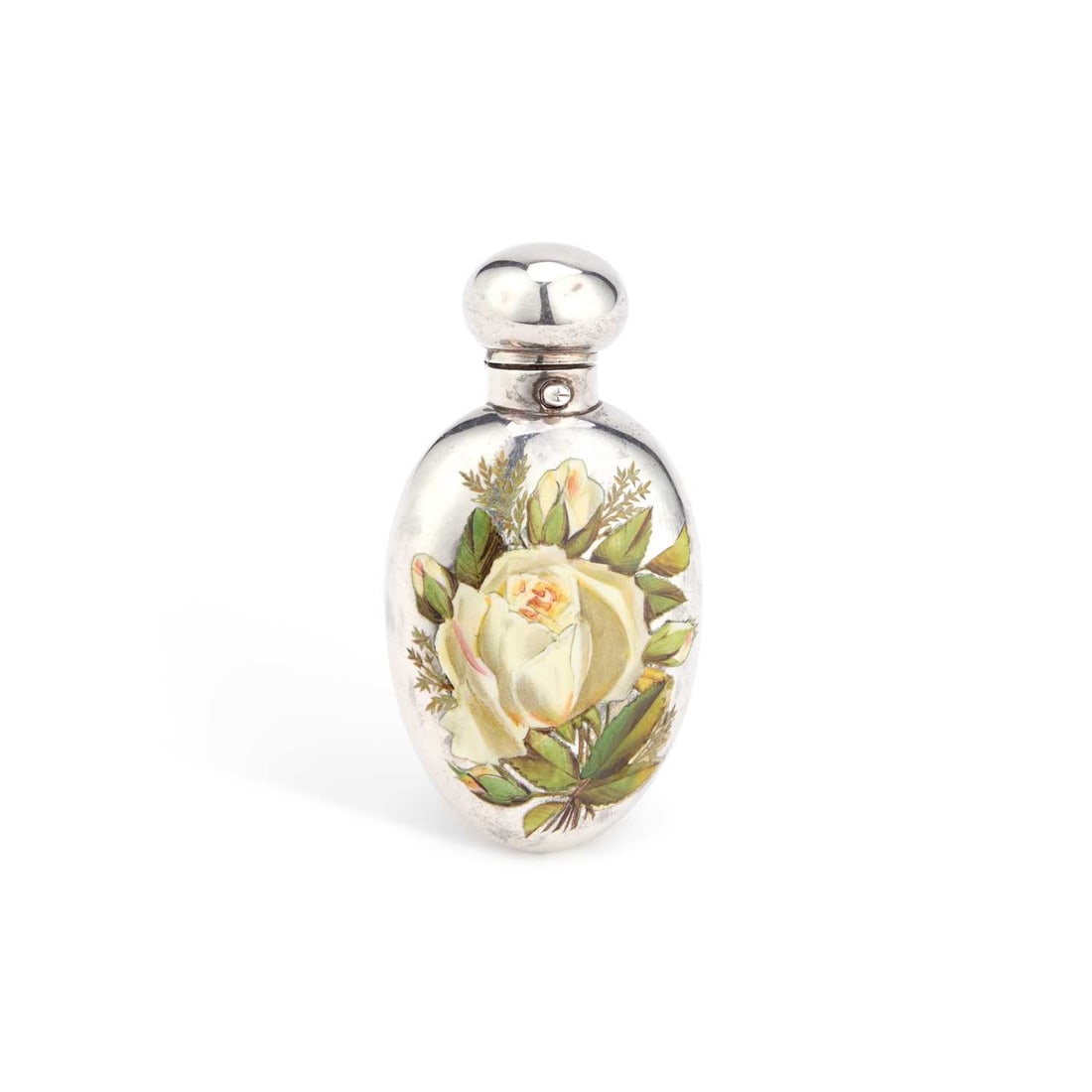 A VICTORIAN SILVER AND ENAMELLED SCENT FLASK: A VICTORIAN SILVER AND ENAMELLED SCENT FLASK by George Heath, London 1885, flattened ovoid form, decorated with white roses and foliage to the front, with a spring-button domed cap. 7cm high, 1 troy o