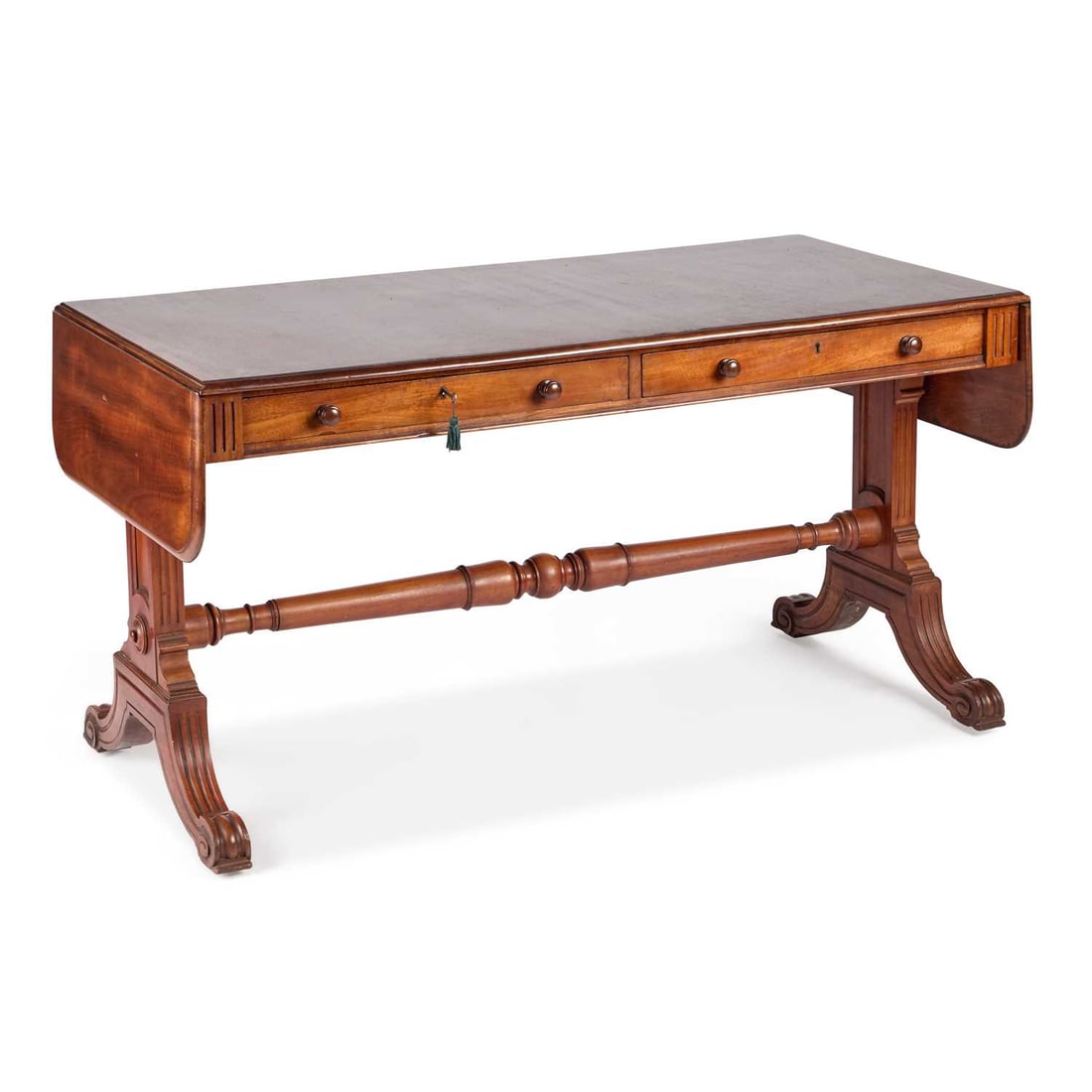 A 19TH CENTURY MAHOGANY SOFA TABLE STAMPED C. HINDLEY & SONS 134 OXFORD ST., LONDON, 6617: A 19TH CENTURY MAHOGANY SOFA TABLE STAMPED C. HINDLEY & SONS 134 OXFORD ST., LONDON, 6617 the long rectangular top with drop ends and a moulded edge, over a pair of frieze drawers (one stamped), raise