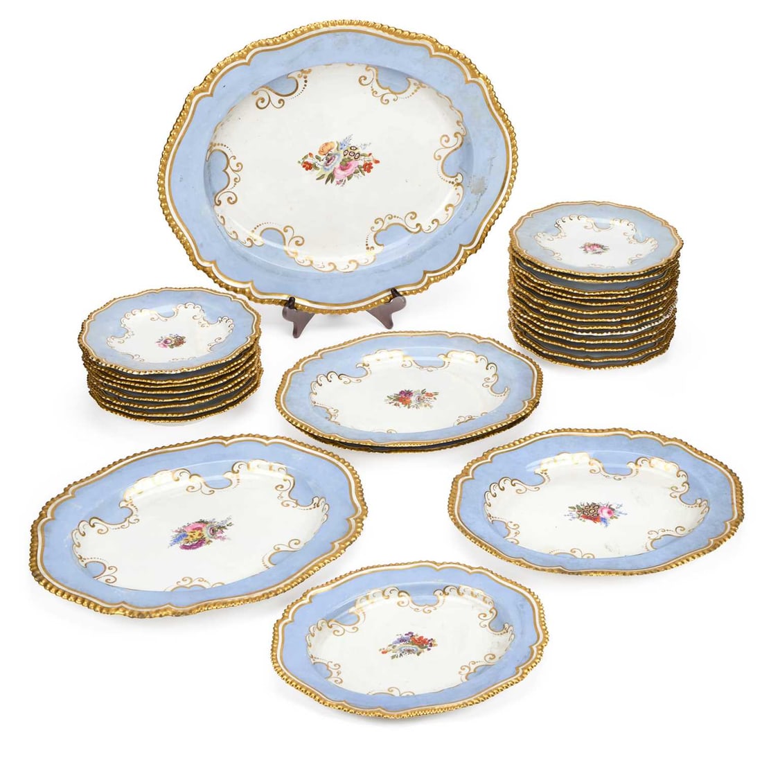 A WORCESTER (FLIGHT, BARR & BARR) PORCELAIN PERIWINKLE-GROUND DINNER SERVICE CIRCA 1815–1820: A WORCESTER (FLIGHT, BARR & BARR) PORCELAIN PERIWINKLE-GROUND DINNER SERVICE CIRCA 1815–1820 comprising six shaped oval serving platters, six soup plates and fifteen dinner plates, with impressed cr