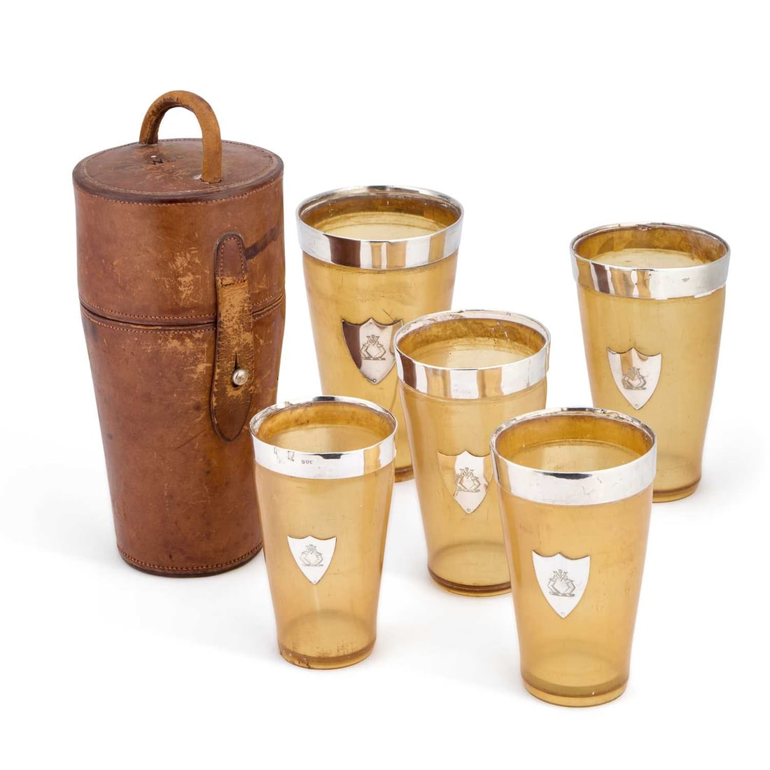 A GROUP OF FIVE VICTORIAN AND LATER SILVER-RIMMED HORN BEAKERS IN A LEATHER CASE: A GROUP OF FIVE VICTORIAN AND LATER SILVER-RIMMED HORN BEAKERS IN A LEATHER CASE various marks, each engraved with a crest. Tallest 14.5cm