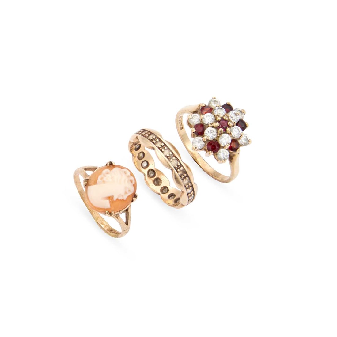 TWO 9 CARAT GOLD RINGS AND ANOTHER RING: TWO 9 CARAT GOLD RINGS AND ANOTHER RING comprising a 9 carat gold garnet and cubic zirconia cluster ring, hallmarked, a white spinel eternity ring, stamped '9CT' and a 9 carat gold cameo ring, hallmar