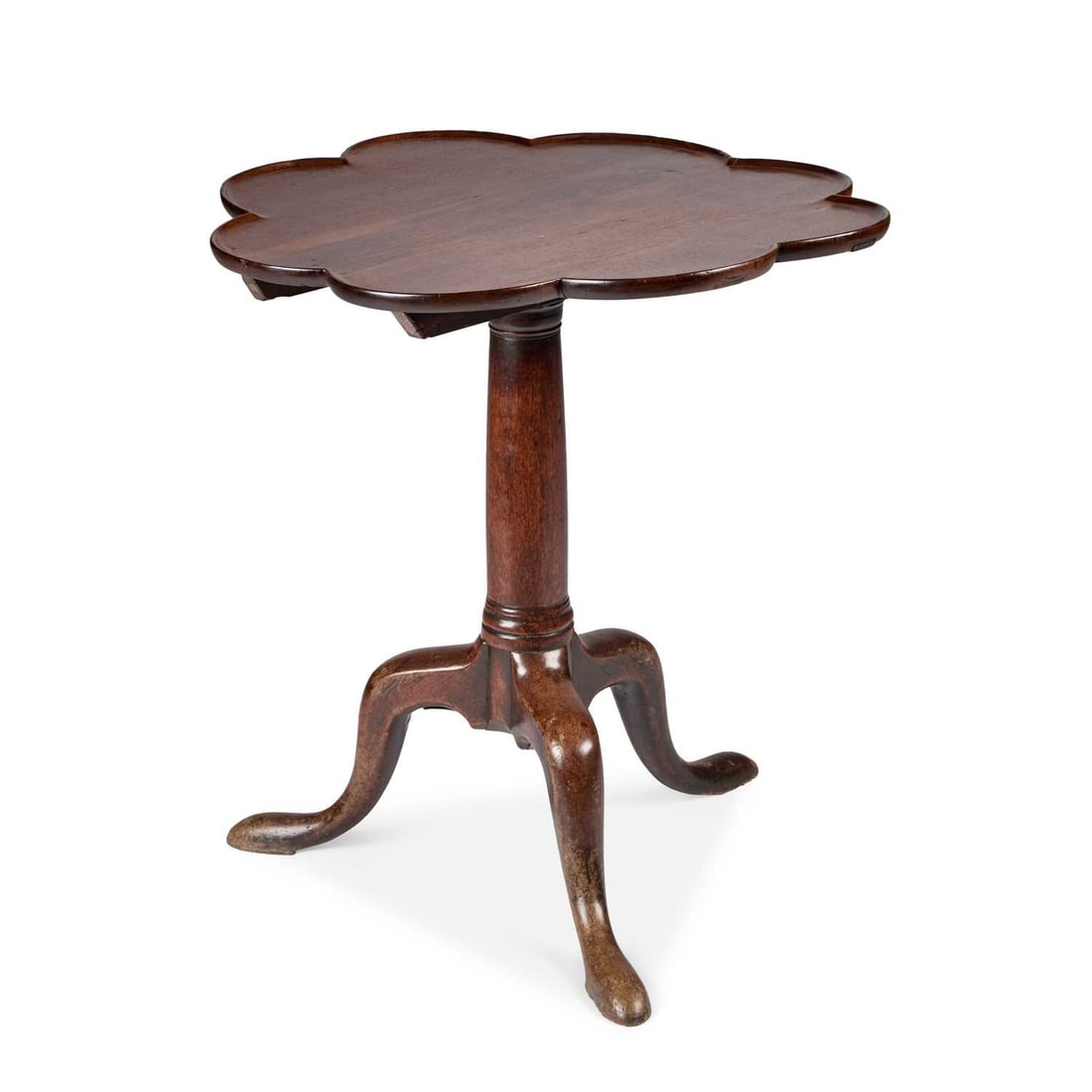 A WALNUT AND OAK TRIPOD TABLE 18TH CENTURY AND LATER: A WALNUT AND OAK TRIPOD TABLE 18TH CENTURY AND LATER the scalloped tilt-top raised on a tapering stem above a tripod base with pad feet. 68cm high, 66.5cm diameter