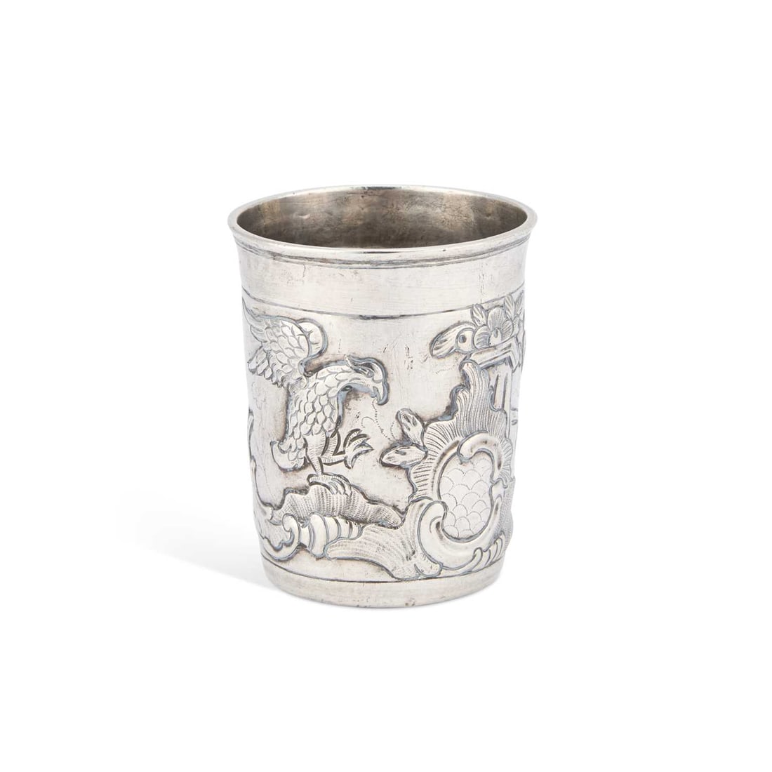 AN 18TH CENTURY RUSSIAN SILVER BEAKER: AN 18TH CENTURY RUSSIAN SILVER BEAKER Moscow 1770, repoussé with eagles, shells and scrolls. 8cm high, 2.2 troy ounces