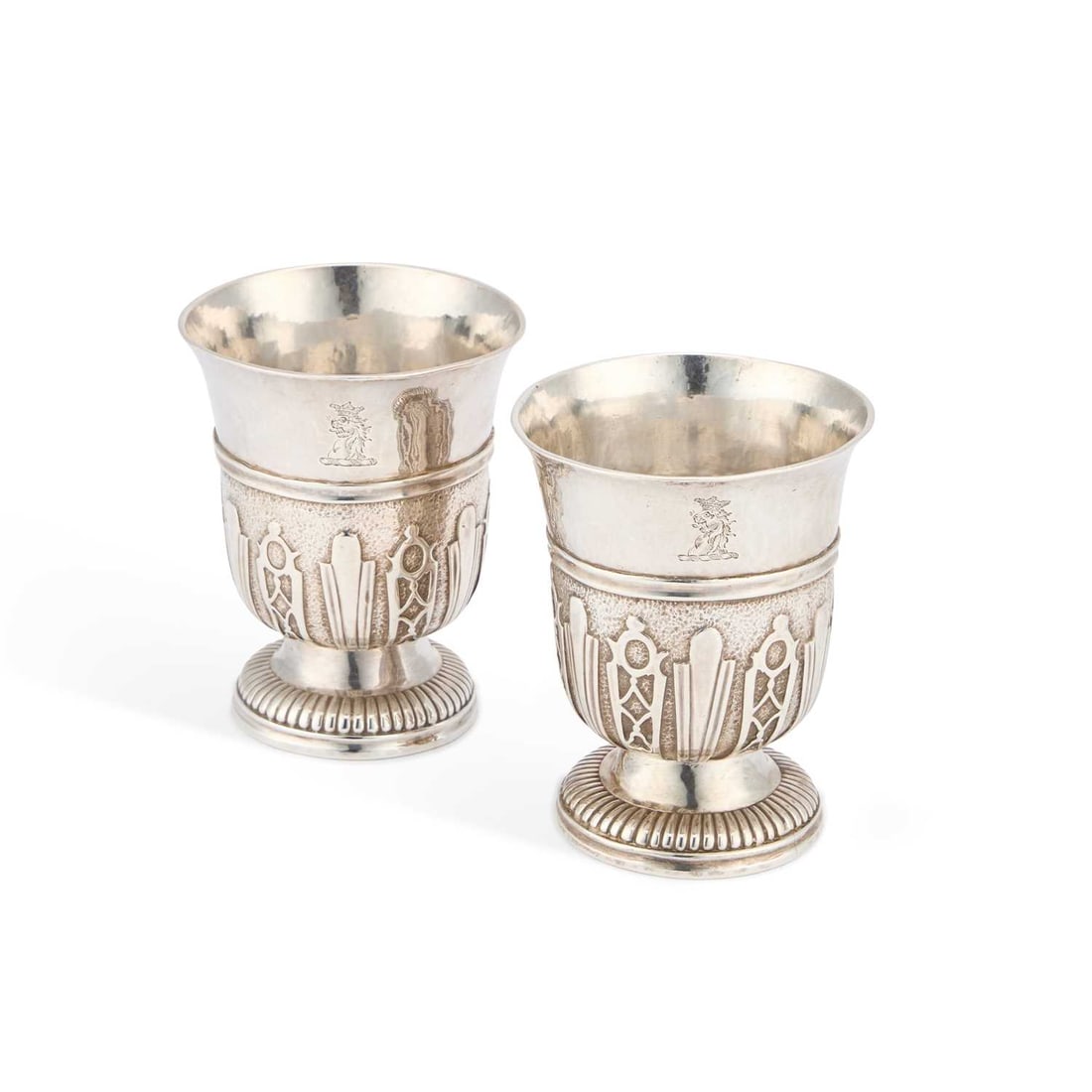 A PAIR OF 18TH CENTURY FRENCH SILVER BEAKERS: A PAIR OF 18TH CENTURY FRENCH SILVER BEAKERS c.1740s, each marked to the underside, the bodies adorned with strapwork on a matted ground, each engraved with a crest. (2) 9.5cm high, 9.6 troy ounces gr