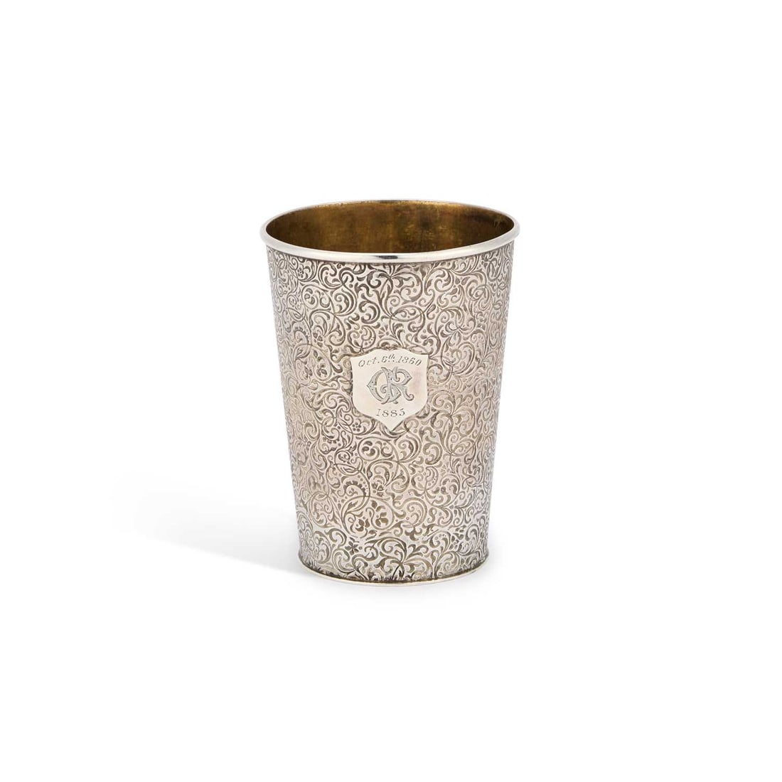 A VICTORIAN SCOTTISH SILVER BEAKER: A VICTORIAN SCOTTISH SILVER BEAKER by John Crichton, Edinburgh 1879, of tapering cylindrical form, the ground densely engraved with scrollwork, monogrammed and dated to a cartouche. 9cm high, 3.2 troy