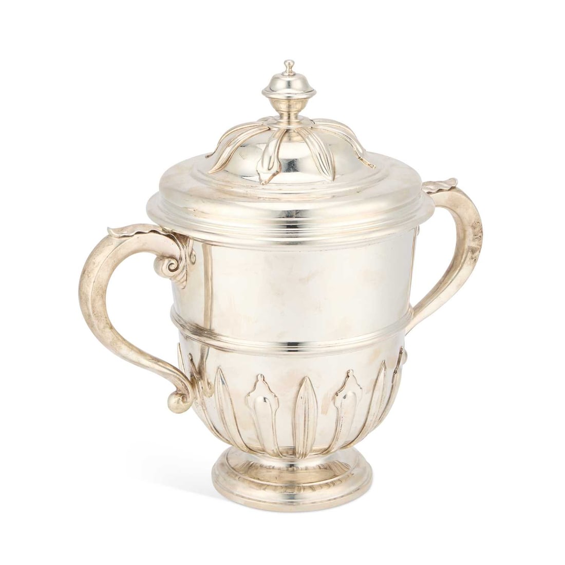 A LARGE GEORGE V SILVER TWO-HANDLED TROPHY CUP AND COVER: A LARGE GEORGE V SILVER TWO-HANDLED TROPHY CUP AND COVER by William Comyns & Sons Ltd (Richard Comyns), London 1929, in mid-18th Century style, with a domed pull-off cover above leaf-capped S-scro