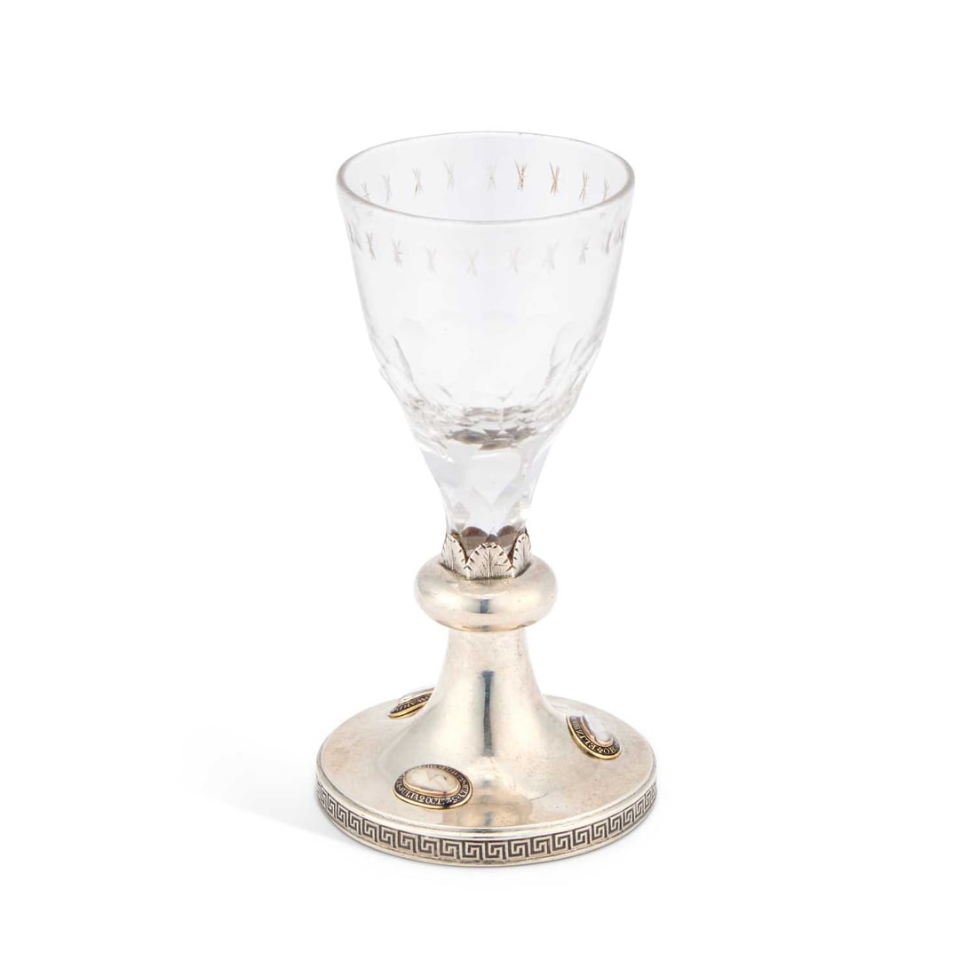 AN INTERESTING GEORGE III SILVER-MOUNTED MOURNING WINE GLASS: AN INTERESTING GEORGE III SILVER-MOUNTED MOURNING WINE GLASS by Robert Garrard, London 1810, the rim of the foot with Greek-Key decoration, the upper side applied with three ovals containing hair, the